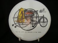 H183 - Souvenir of 1979 Milk Race - Enameled Cork Backed Teapot Stand 