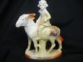 10781 Unmarked (German) Crested China Lucky White Heather Girl on a Donkey from Guernsey 